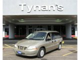 Light Parchment Gold Metallic Ford Windstar in 2000
