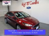 2015 Ruby Red Metallic Ford Focus SE Sedan #105638546