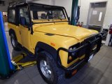 Yellow Land Rover Defender in 1994