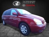 Claret Red Kia Sedona in 2010