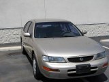 1996 Pebble Beige Metallic Nissan Maxima GXE #12460076