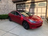 Red Multi-Coat Tesla Model 3 in 2018