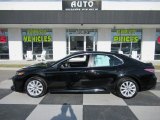 2019 Midnight Black Metallic Toyota Camry LE #136321915