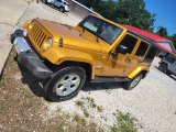 2014 Jeep Wrangler Unlimited Sahara 4x4 Front 3/4 View