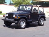 1999 Black Jeep Wrangler Sahara 4x4 #14434134