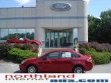 2010 Sangria Red Metallic Ford Focus SE Sedan #15959658