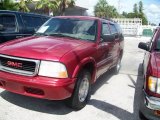 Magnetic Red Metallic GMC Jimmy in 2001
