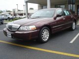 Dark Cherry Metallic Lincoln Town Car in 2006