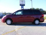 2009 Salsa Red Pearl Toyota Sienna LE #19365319