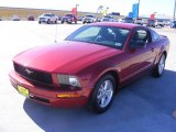 2008 Dark Candy Apple Red Ford Mustang V6 Deluxe Coupe #2089038