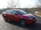 2010 Sangria Red Metallic Ford Focus SES Sedan #22764453