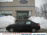 2010 Ebony Black Ford Focus SE Sedan #25964524