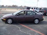 1999 Brown Saturn S Series SL2 Sedan #26672728