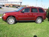 2009 Red Rock Crystal Pearl Jeep Grand Cherokee Laredo #26778585