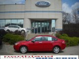 2010 Sangria Red Metallic Ford Focus SEL Sedan #28092173