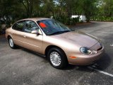 Light Saddle Metallic Ford Taurus in 1996