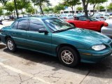 1997 Medium Green Blue Metallic Pontiac Grand Am SE Sedan #29097241