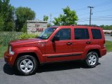 Sunburst Orange Pearl Jeep Liberty in 2010