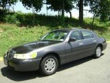Midnight Grey Metallic Lincoln Town Car in 1999