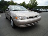 2000 Sandrift Metallic Toyota Corolla CE #31426564