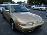 Gold Metallic Oldsmobile Alero in 1999