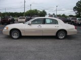 Light Parchment Gold Metallic Lincoln Town Car in 2001