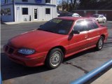 1997 Bright Red Pontiac Grand Am SE Sedan #3569239