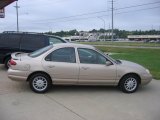 Light Prairie Tan Metallic Ford Contour in 1998