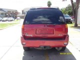 Magnetic Red Metallic GMC Envoy in 2003