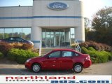 2011 Sangria Red Metallic Ford Focus SE Sedan #37896155
