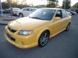 Vivid Yellow Mazda Protege in 2003