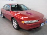 Crimson Red Metallic Oldsmobile Intrigue in 1999
