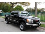 2004 GMC Sierra 2500HD SLE Extended Cab 4x4 Front 3/4 View