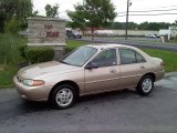 Mocha Frost Metallic Ford Escort in 2000