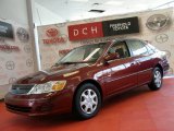 Vintage Red Pearl Toyota Avalon in 2002