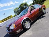 Crimson Pearl Red Cadillac DeVille in 2001