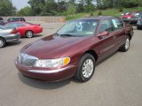Autumn Red Metallic Lincoln Continental in 2000