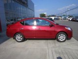 Red Brick Nissan Versa in 2012