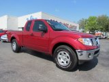 Red Brick Nissan Frontier in 2010