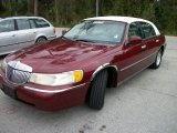 Cordovan Red Metallic Lincoln Town Car in 1998