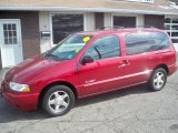 Sunset Red Nissan Quest in 2000