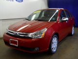 2010 Sangria Red Metallic Ford Focus SEL Sedan #63384302