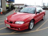 Bright Red Pontiac Grand Am in 1997