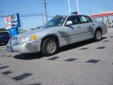 Silver Frost Metallic Lincoln Town Car in 1999