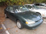 Green Metallic Chevrolet Prizm in 2001