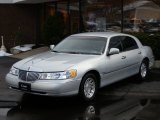 Silver Frost Metallic Lincoln Town Car in 1999
