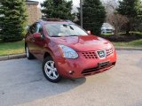 2010 Venom Red Nissan Rogue SL AWD #74625177