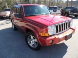 2009 Red Rock Crystal Pearl Jeep Commander Sport #76873881