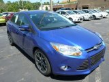 2014 Performance Blue Ford Focus SE Sedan #83935070