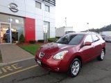 2010 Venom Red Nissan Rogue SL AWD #84358020